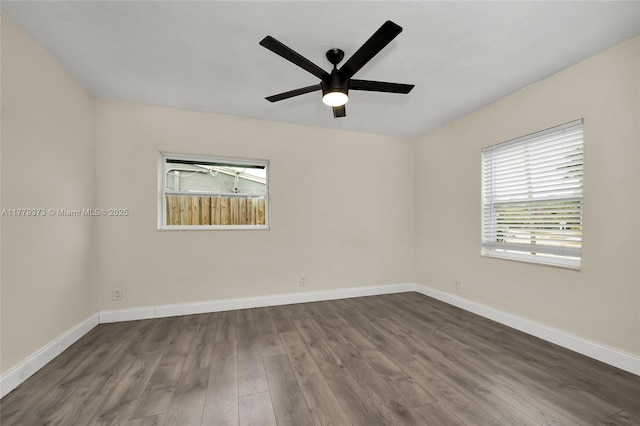 411 NE 58th Ct, Oakland Park, FL 33334 - empty room with a ceiling fan, baseboards, and dark wood finished floors