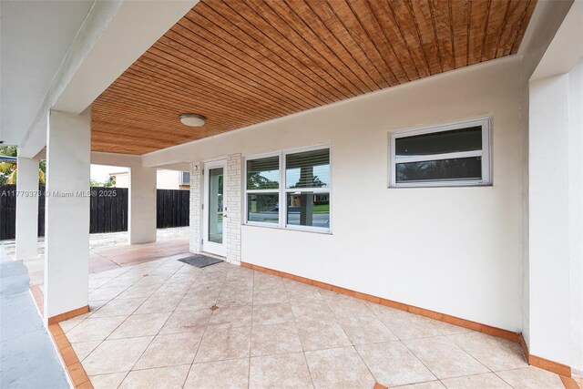 411 NE 58th Ct, Oakland Park, FL 33334 - view of patio / terrace with fence