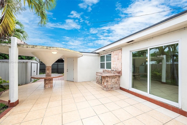 411 NE 58th Ct, Oakland Park, FL 33334 - view of patio featuring a sink and fence