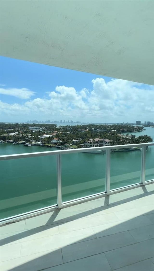 balcony with a view of city and a water view