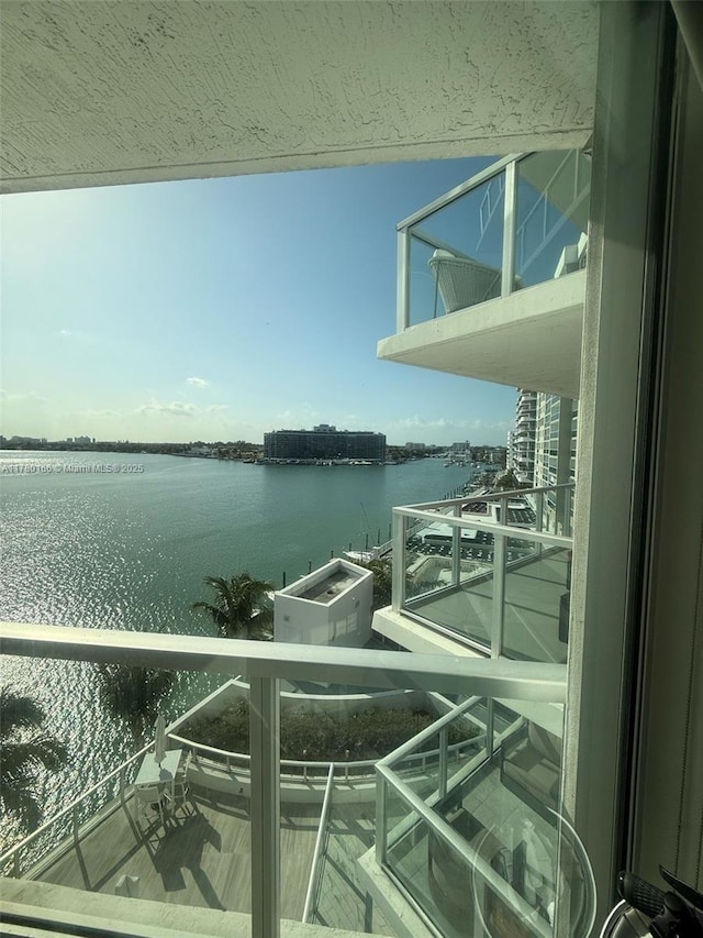 balcony featuring a water view