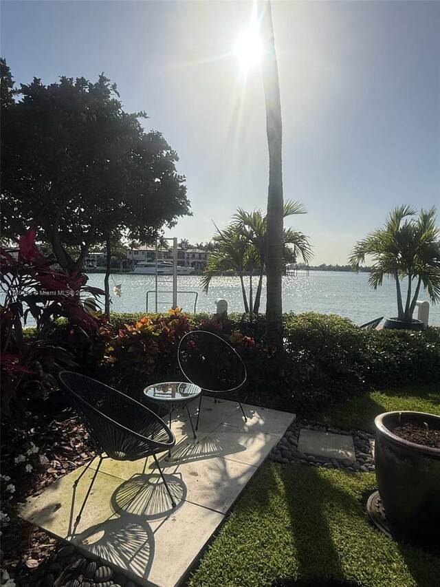 view of patio with a water view