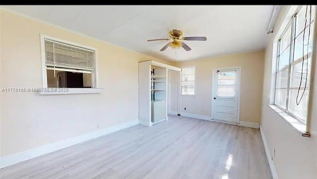 1424 Margina Ave, Daytona Beach, FL 32114 - unfurnished room featuring ceiling fan, light wood-style floors, and baseboards