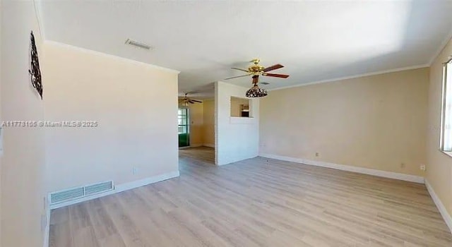 1424 Margina Ave, Daytona Beach, FL 32114 - spare room with baseboards, a ceiling fan, crown molding, visible vents, and light wood finished floors