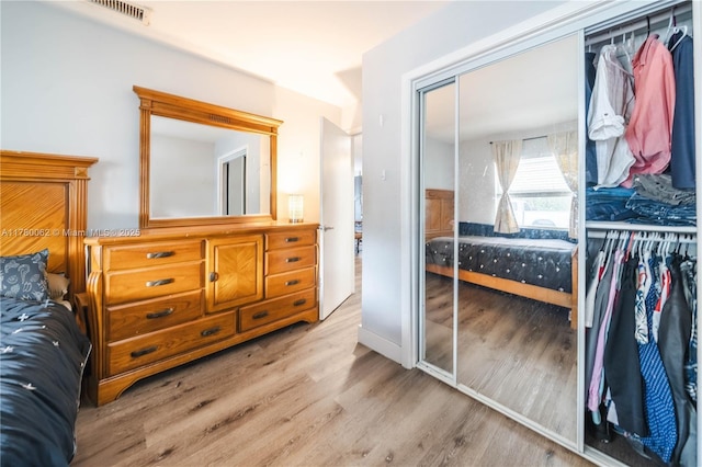 5715 Garfield St, Hollywood, FL 33021 - bedroom featuring visible vents, a closet, and wood finished floors