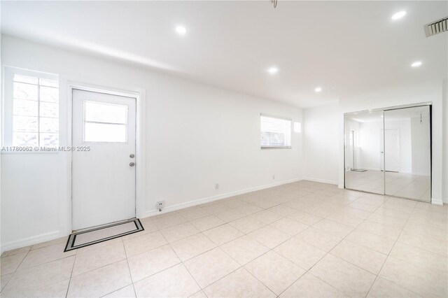 5715 Garfield St, Hollywood, FL 33021 - interior space featuring visible vents, baseboards, recessed lighting, and light tile patterned floors