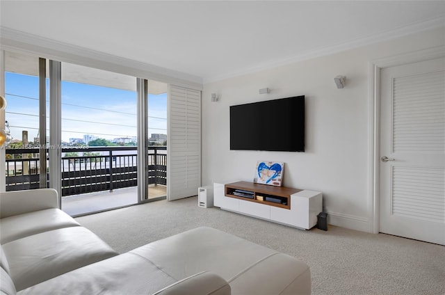 carpeted living room featuring crown molding and baseboards