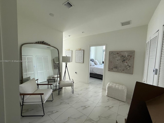 2000 Metropica Way Unit 603, Sunrise, FL 33323 - bedroom featuring marble look tile flooring and baseboards