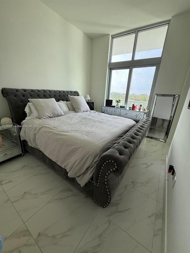 2000 Metropica Way Unit 603, Sunrise, FL 33323 - bedroom featuring light marble finish flooring