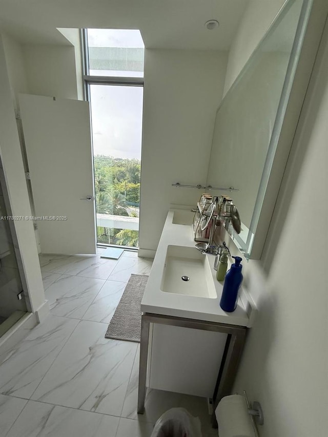2000 Metropica Way Unit 603, Sunrise, FL 33323 - full bath with marble finish floors, double vanity, and a shower stall