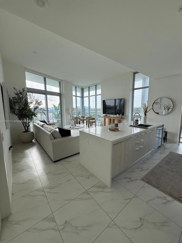 2000 Metropica Way Unit 603, Sunrise, FL 33323 - living room featuring light marble finish flooring and expansive windows