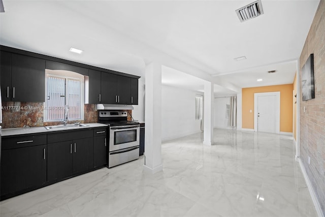 721 NW 6th St, Hallandale Beach, FL 33009 - kitchen featuring visible vents, dark cabinetry, electric stove, marble finish floor, and a sink