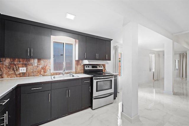 721 NW 6th St, Hallandale Beach, FL 33009 - kitchen featuring tasteful backsplash, a sink, light countertops, electric stove, and marble finish floor