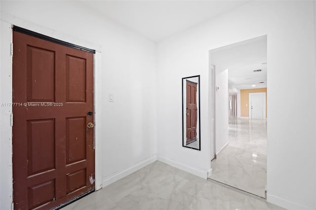 721 NW 6th St, Hallandale Beach, FL 33009 - entryway featuring marble finish floor and baseboards