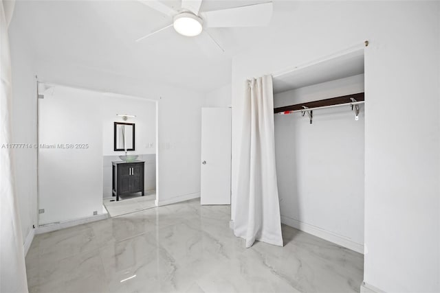 721 NW 6th St, Hallandale Beach, FL 33009 - unfurnished bedroom with a closet, ceiling fan, marble finish floor, and baseboards