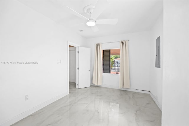 721 NW 6th St, Hallandale Beach, FL 33009 - empty room featuring electric panel, marble finish floor, baseboards, and ceiling fan