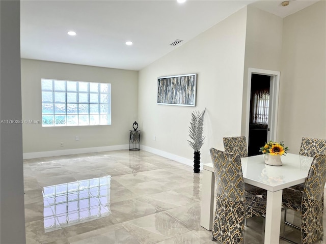 dining room with visible vents, baseboards, recessed lighting, vaulted ceiling, and marble finish floor