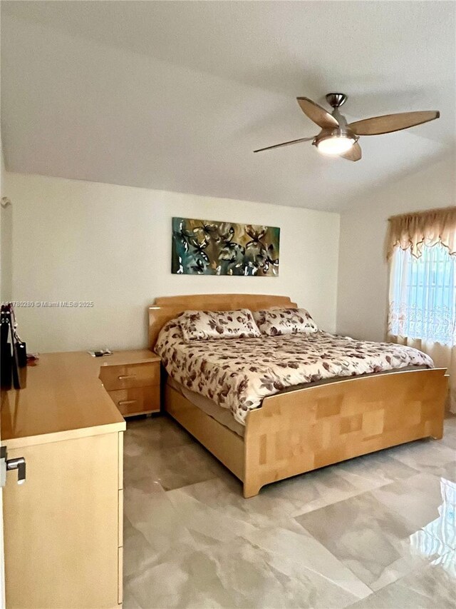 bedroom with light floors and a ceiling fan