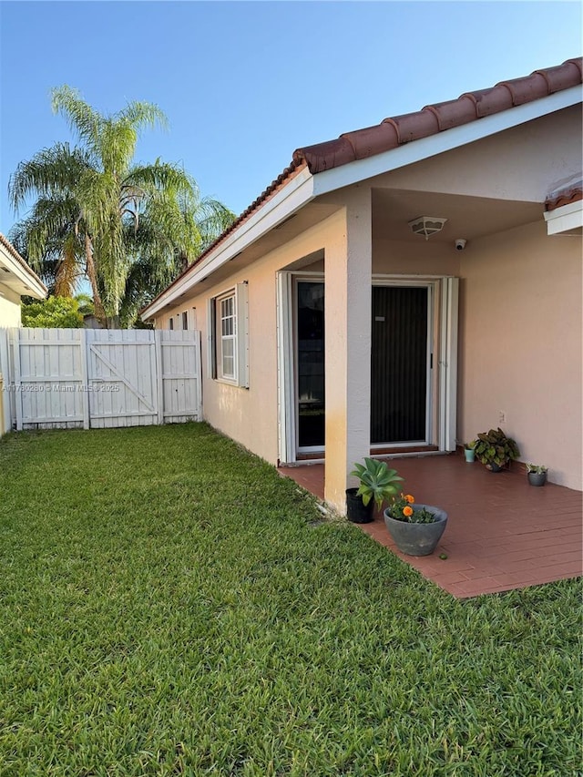 view of yard with fence and a gate