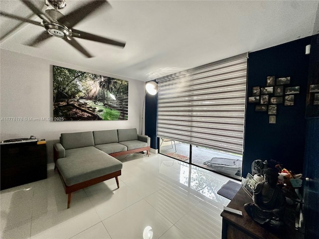 tiled living area with a ceiling fan