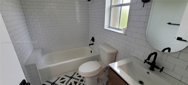 full bathroom featuring bathtub / shower combination, vanity, tile walls, and toilet