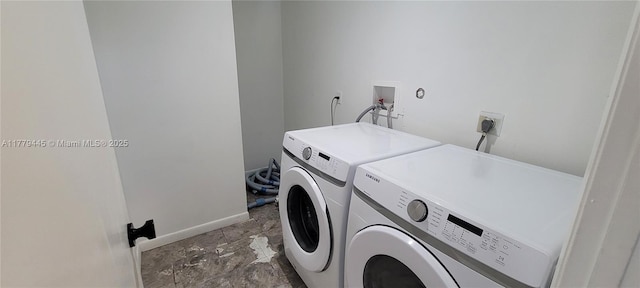 laundry area featuring washer and dryer, laundry area, and baseboards