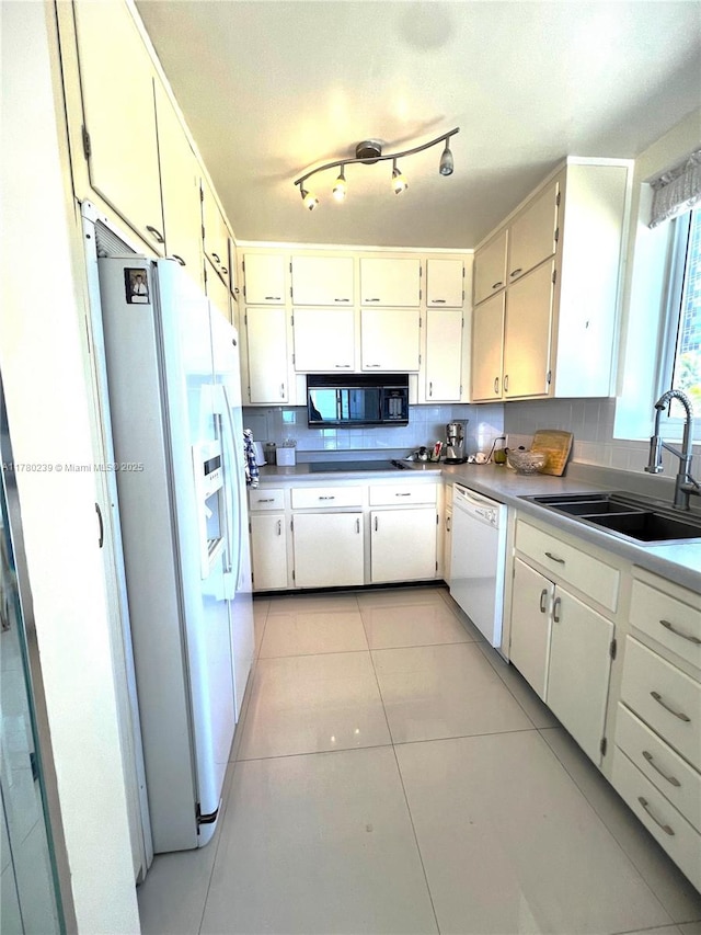 345 N Fort Lauderdale Beach Blvd Unit 202, Fort Lauderdale, FL 33304 - kitchen featuring light tile patterned floors, a sink, and white appliances