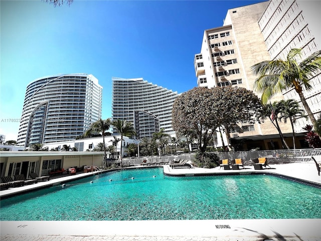 345 N Fort Lauderdale Beach Blvd Unit 202, Fort Lauderdale, FL 33304 - community pool featuring a patio and fence