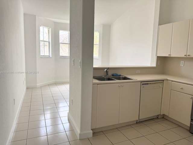 2524 SE 16th Rd Unit 201, Homestead, FL 33035 - kitchen featuring baseboards, light countertops, light tile patterned flooring, white dishwasher, and a sink