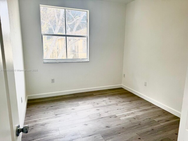 2524 SE 16th Rd Unit 201, Homestead, FL 33035 - unfurnished room featuring wood finished floors and baseboards