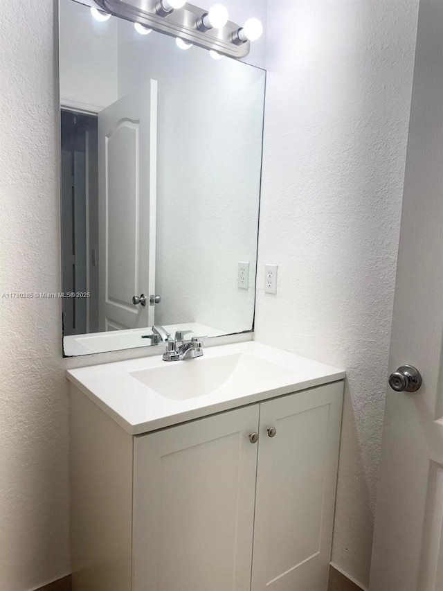 2524 SE 16th Rd Unit 201, Homestead, FL 33035 - bathroom with vanity and a textured wall
