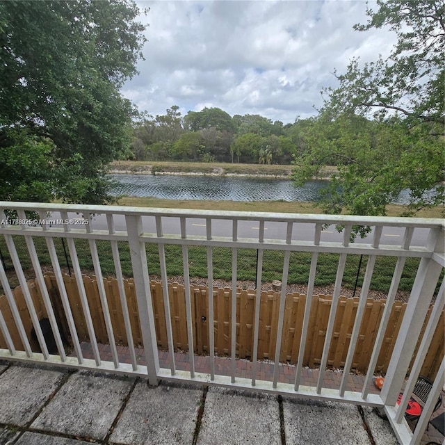balcony featuring a water view