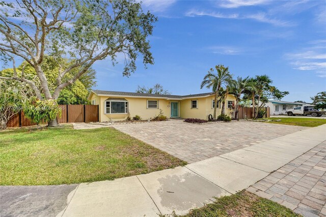 16395 SW 279th St, Homestead, FL 33031 - ranch-style house featuring stucco siding and decorative driveway
