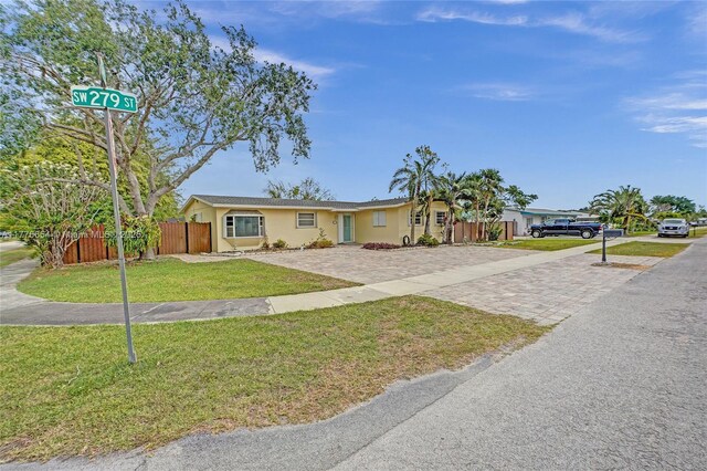 16395 SW 279th St, Homestead, FL 33031 - single story home featuring stucco siding and driveway