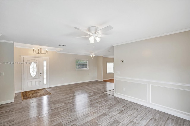16395 SW 279th St, Homestead, FL 33031 - entrance foyer with ornamental molding, a chandelier, wood finished floors, ceiling fan, and baseboards