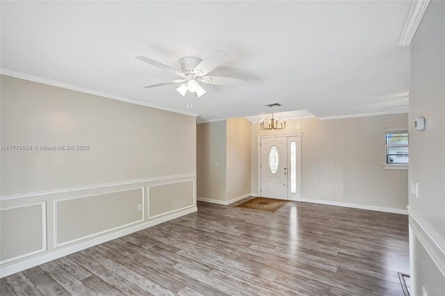 16395 SW 279th St, Homestead, FL 33031 - foyer featuring a chandelier, wood finished floors, ornamental molding, a ceiling fan, and baseboards