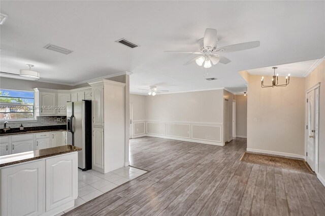 16395 SW 279th St, Homestead, FL 33031 - kitchen with stainless steel fridge, a sink, ceiling fan, open floor plan, and light wood finished floors