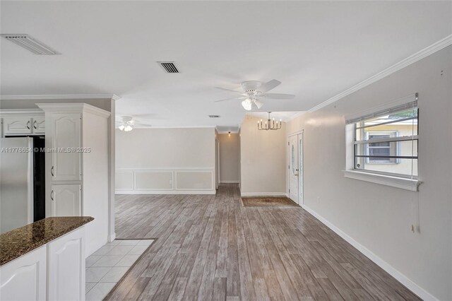 16395 SW 279th St, Homestead, FL 33031 - unfurnished living room with a ceiling fan, a chandelier, light wood-type flooring, and ornamental molding