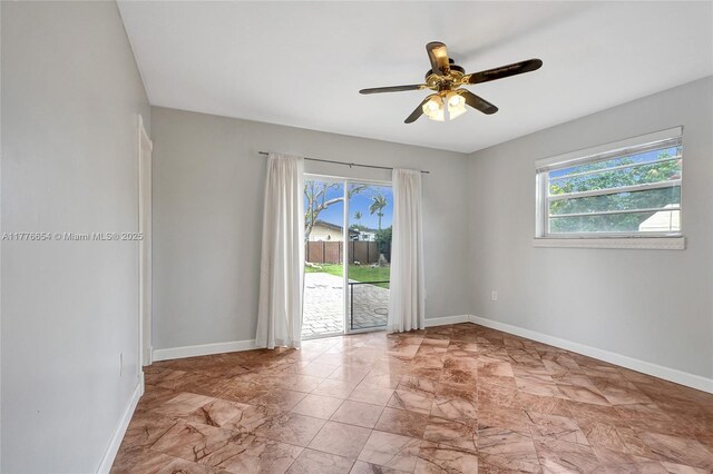 16395 SW 279th St, Homestead, FL 33031 - unfurnished room featuring baseboards, a ceiling fan, and marble look tile flooring