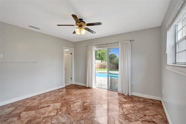 16395 SW 279th St, Homestead, FL 33031 - spare room featuring ceiling fan and baseboards