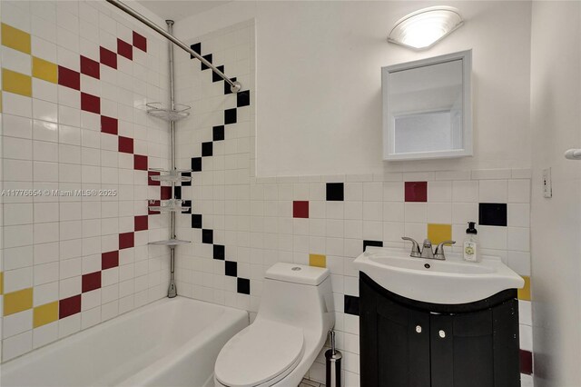 16395 SW 279th St, Homestead, FL 33031 - bathroom featuring toilet, vanity, bathtub / shower combination, and tile walls