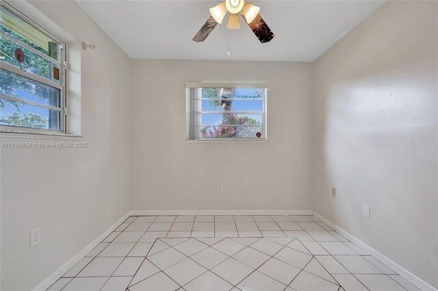16395 SW 279th St, Homestead, FL 33031 - spare room featuring plenty of natural light, ceiling fan, baseboards, and light tile patterned floors