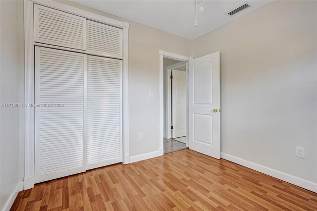 16395 SW 279th St, Homestead, FL 33031 - unfurnished bedroom with light wood-type flooring, baseboards, and a closet