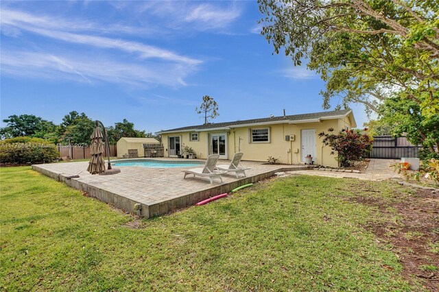 16395 SW 279th St, Homestead, FL 33031 - rear view of house featuring a patio, stucco siding, and a storage shed