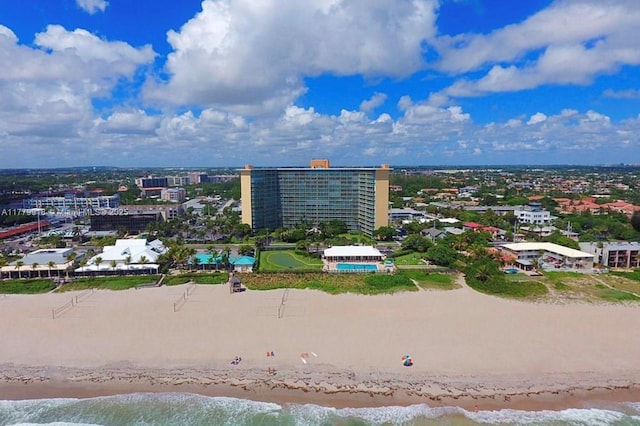 aerial view with a city view, a beach view, and a water view