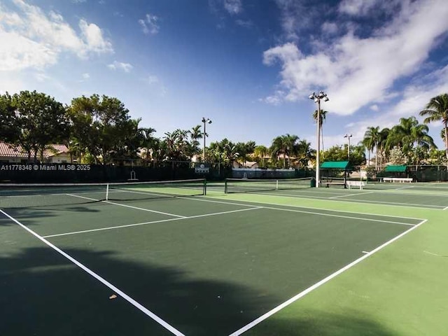 view of sport court featuring community basketball court and fence