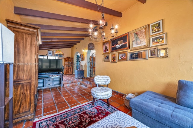 living room featuring beam ceiling, a textured wall, a chandelier, and tile patterned flooring