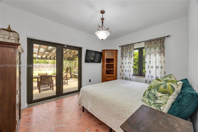 bedroom featuring access to outside and french doors