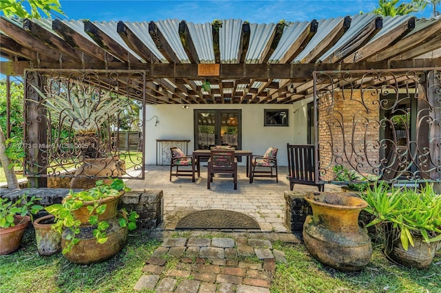 view of patio featuring outdoor dining space and french doors