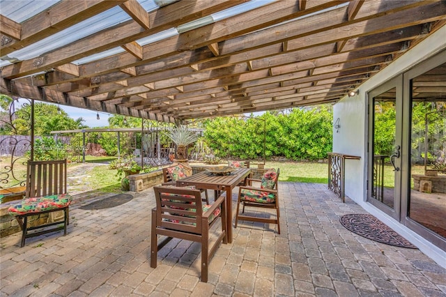 view of patio with a fenced backyard, a pergola, and outdoor dining area